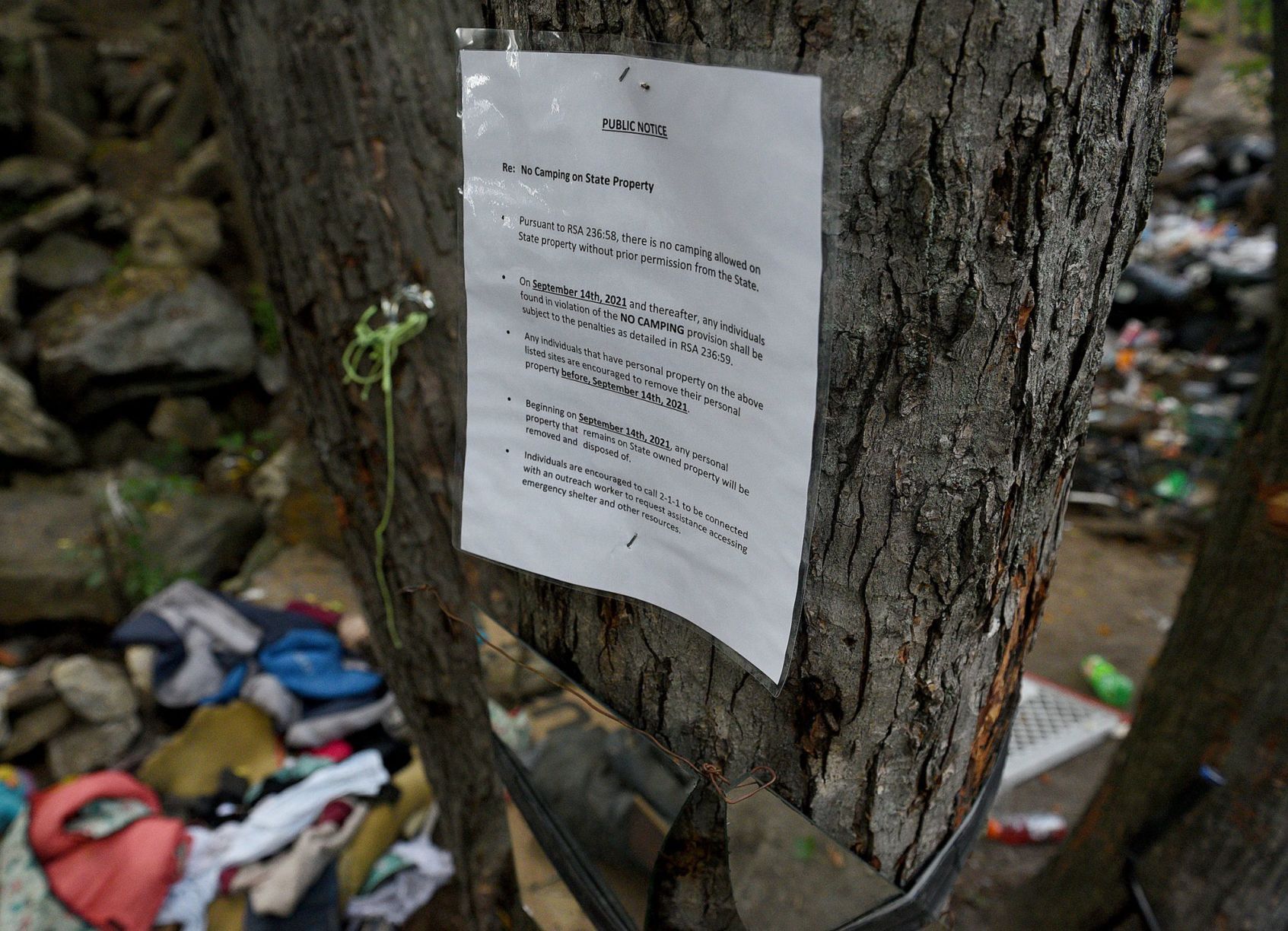 Sign warns Manchester homeless camp residents